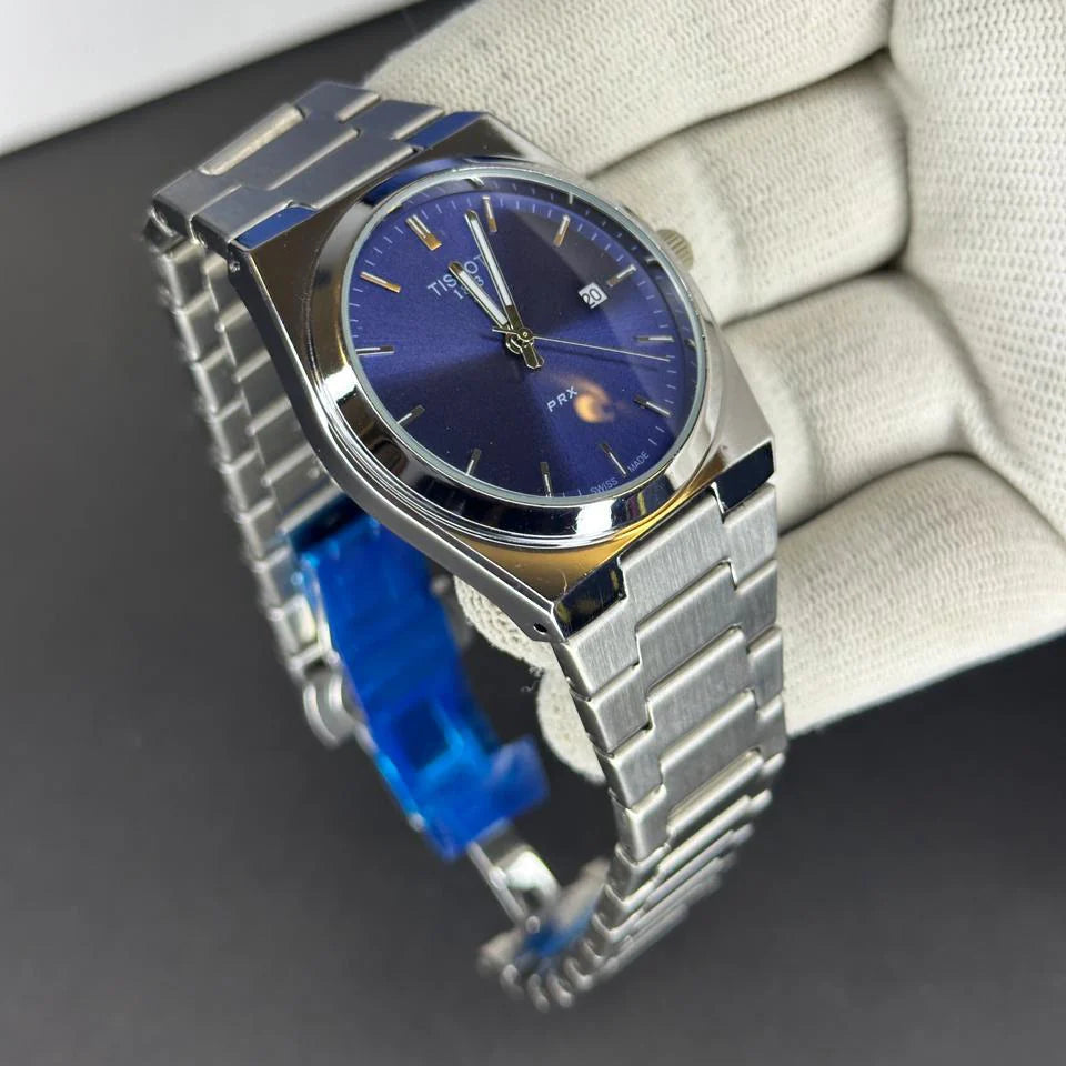 Tisot watch with blue accents on a gray surface
